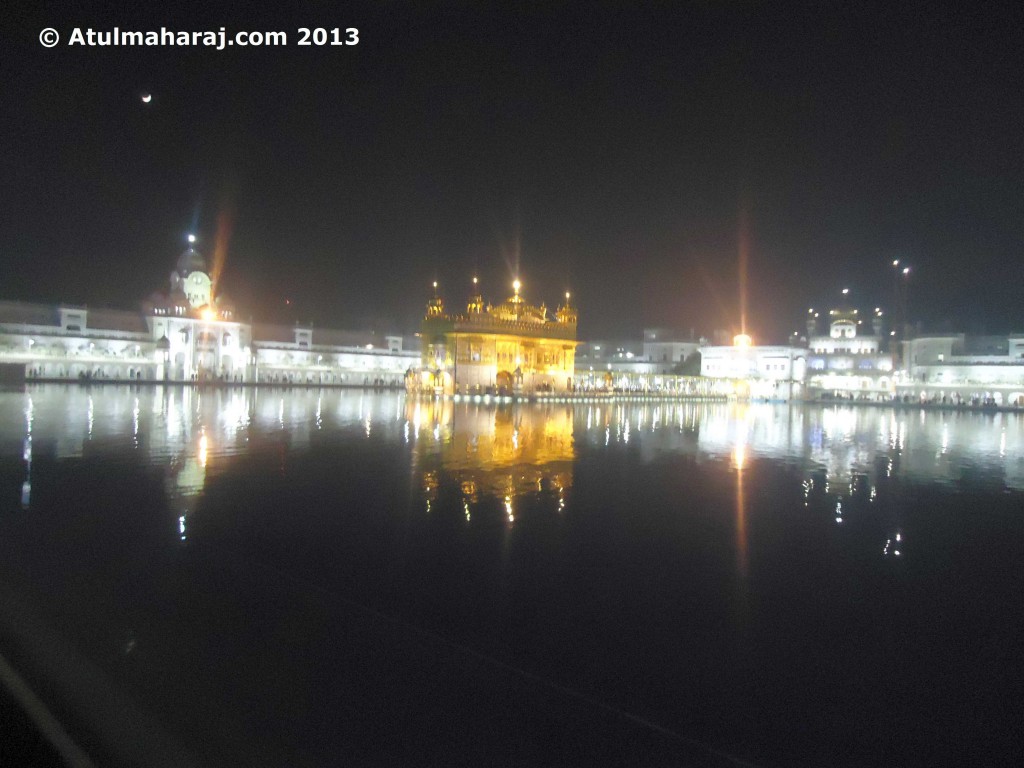 Golden Temple lit up in evening.