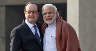 French President Francois Hollande, left, poses with Indian Prime Minister Narendra Modi, during a visit to the Capitol Complex in Chandigarh. Image Courtesy: IndianExpress