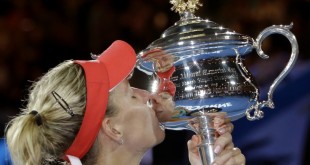 Kerber with the Australian Open Trophy. Image Courtesy: sfchronicle.com