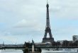 Statue of Liberty infront of Eiffel Tower.